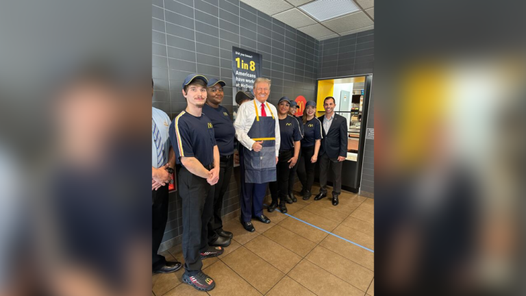 donald trump smiles with mcdonalds staff before working as a fry cook